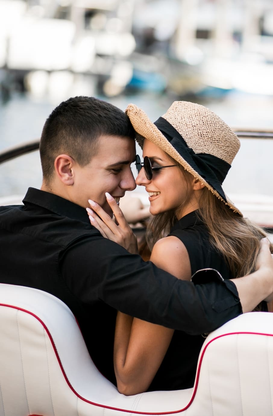 man and woman sitting in a boat